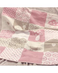 Zachte babydeken in de tinten roze, roomwit en taupe