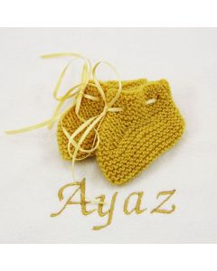 Gebreide slofjes op katoenen babydeken - divere kleuren